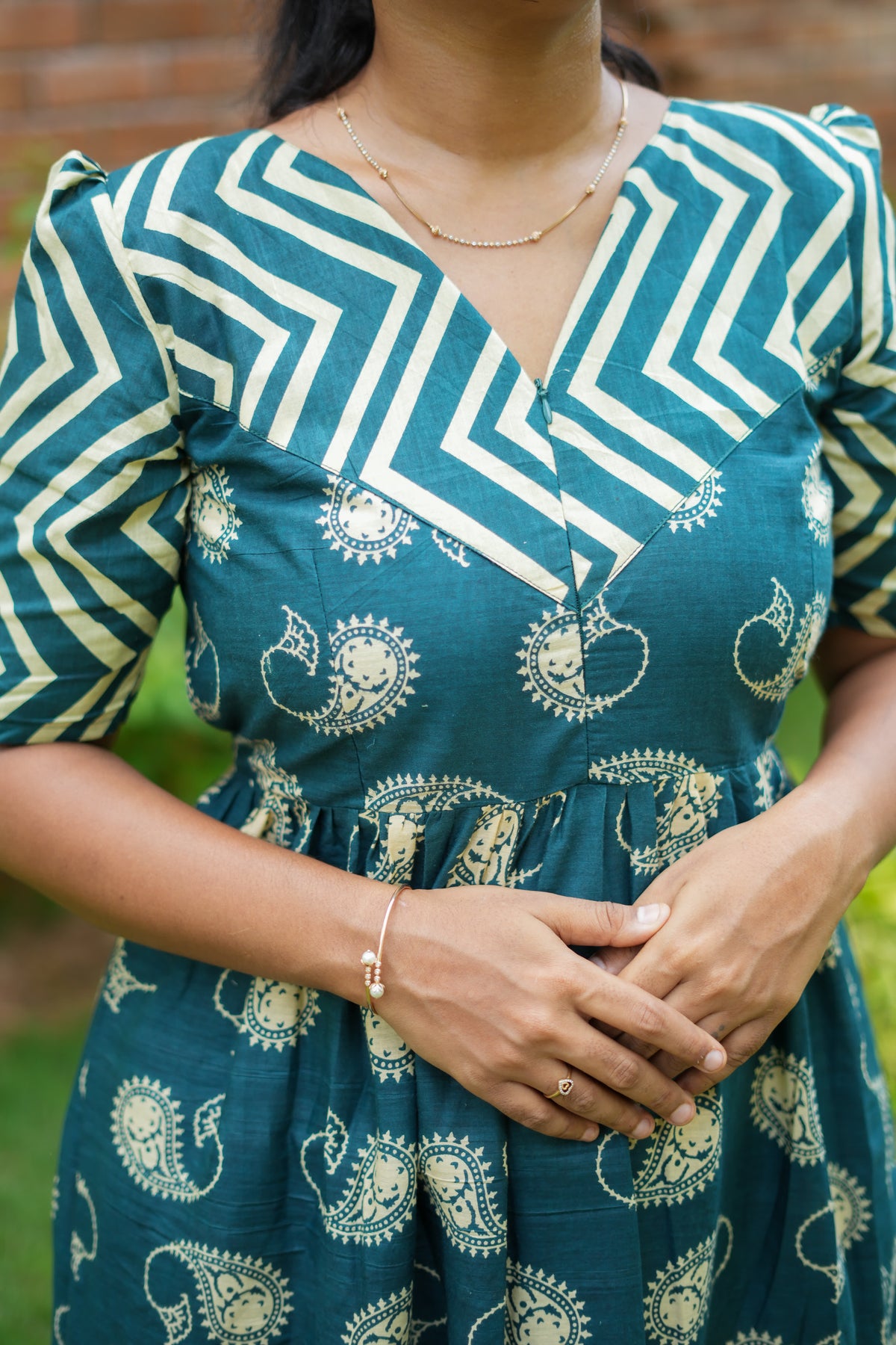 Detailed view of the front zipper and paisley pattern on the cotton maxi nighty