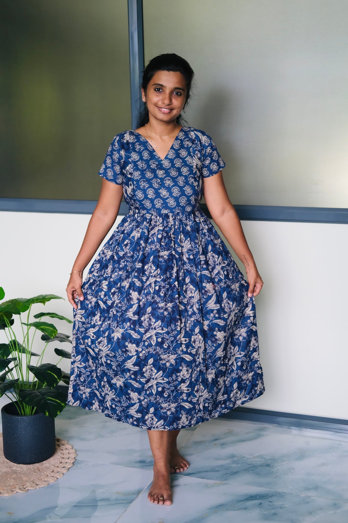 A flared ladies cotton midi nighty in indigo blue with traditional floral block prints