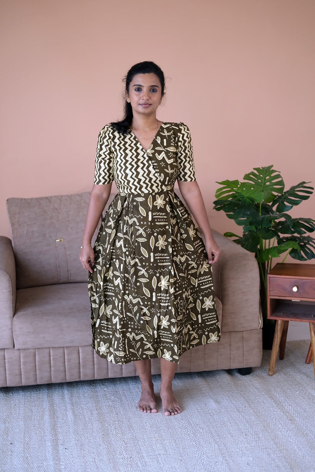 Olive green cotton midi nighty with a dual-print wrap bodice and pleated skirt.