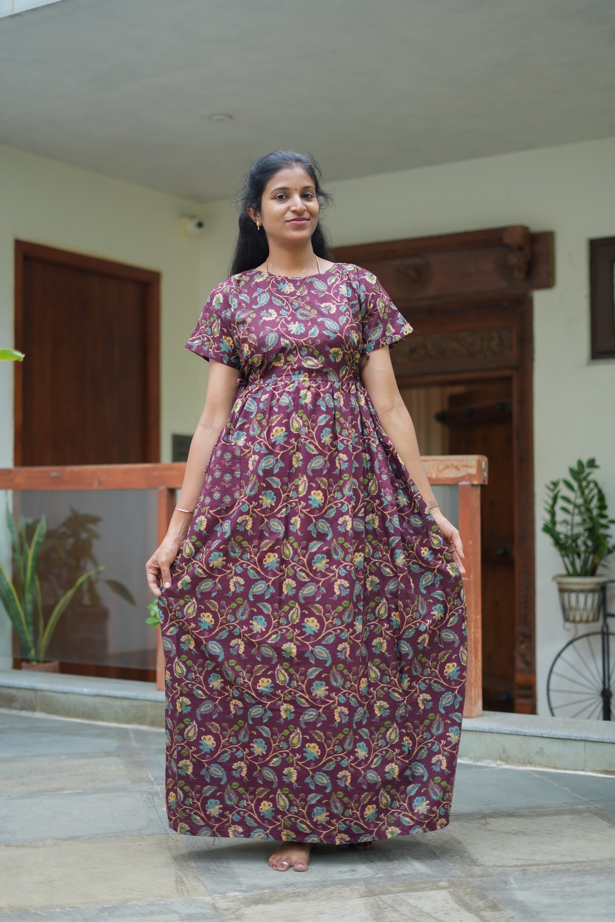 Full-length view of the Sowbi maroon cotton maxi nighty showing its relaxed fit and side pocket