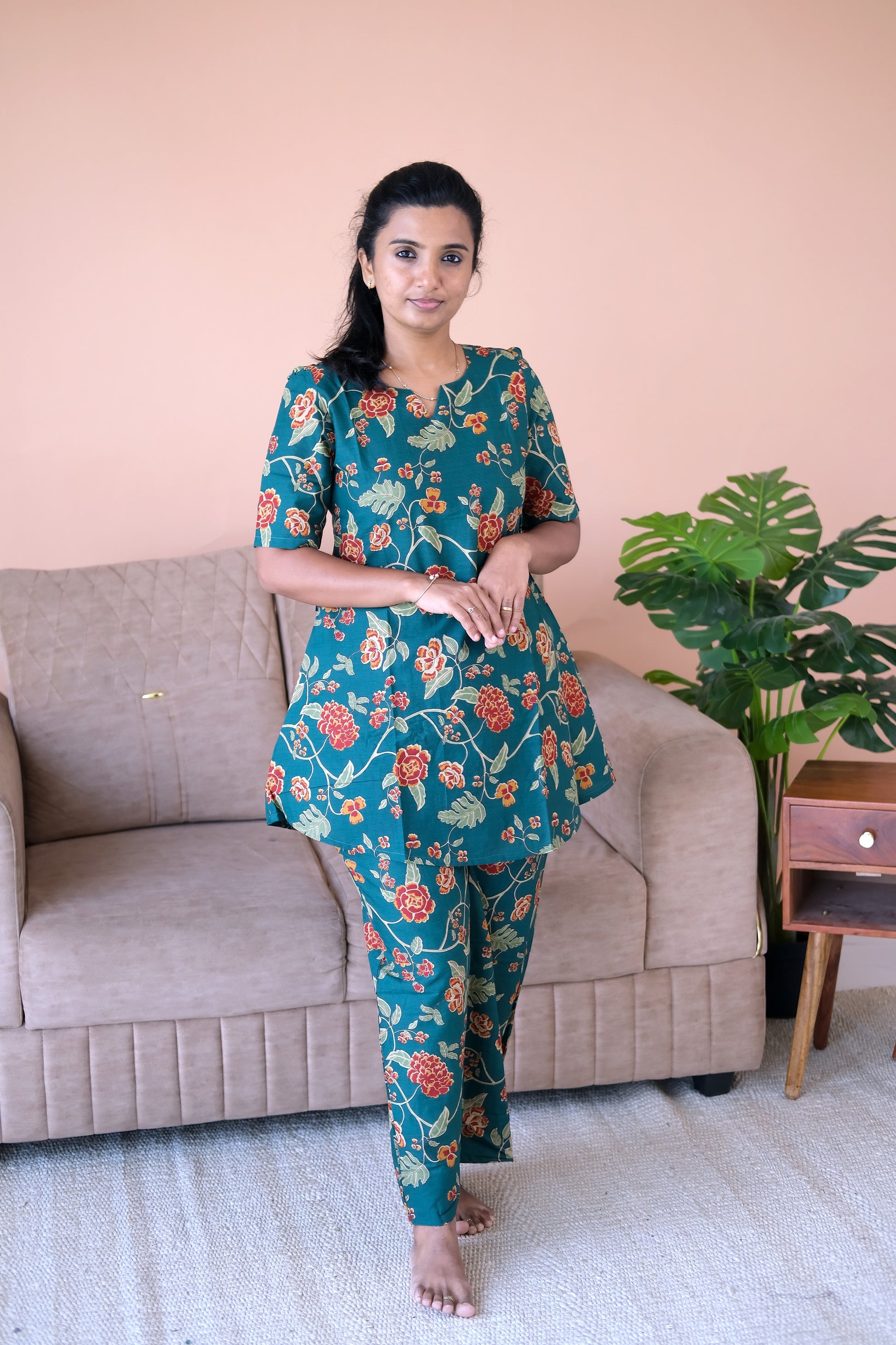 Deep teal cotton night suit for women featuring a red and orange floral vine print with matching relaxed-fit pants.