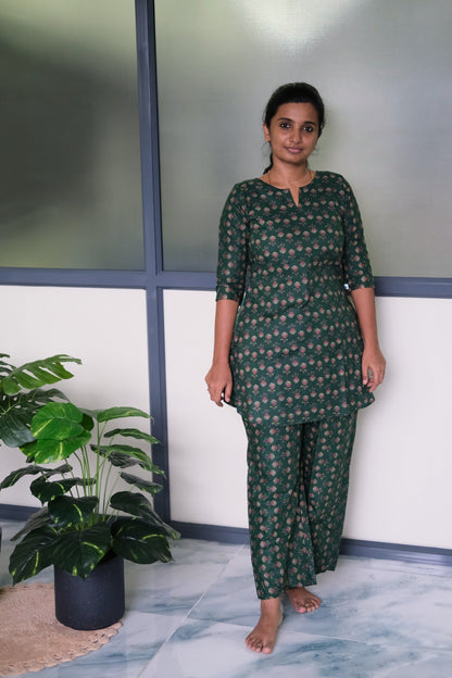 Full-length view of the Heera green cotton night suit featuring 3/4 sleeves and matching printed trousers.