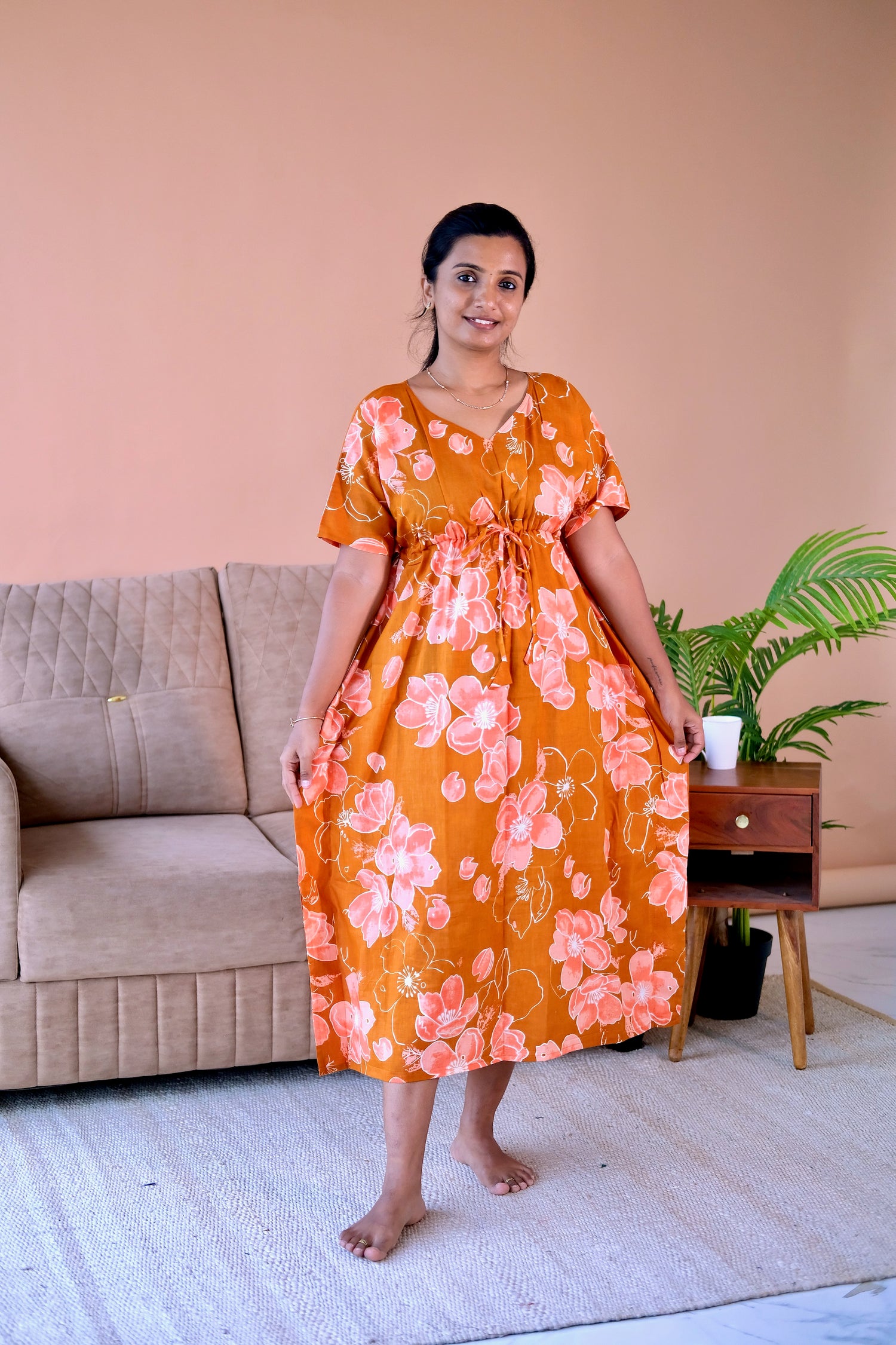 Rust orange cotton kaftan nighty with pink floral print and adjustable drawstring waist.