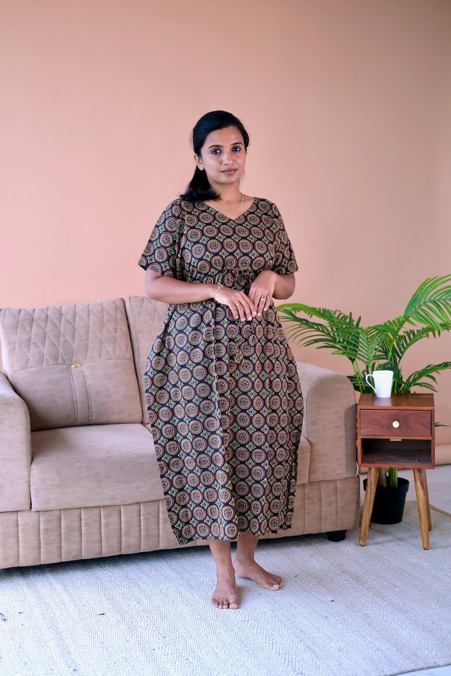 Black cotton kaftan nighty featuring a traditional circular geometric ajrakh print and an adjustable drawstring waist.