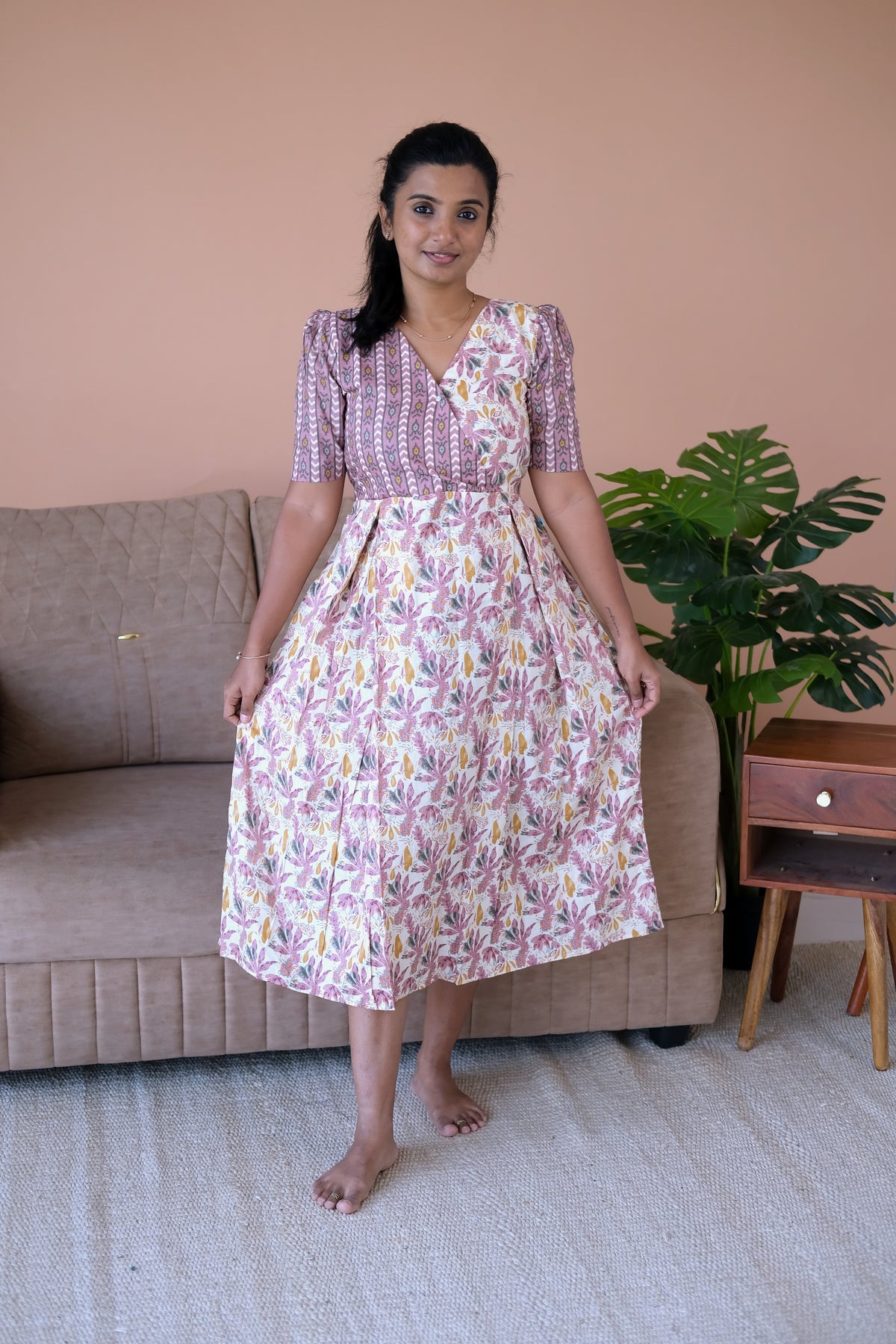 A comfortable ladies cotton midi nighty featuring a floral print skirt and geometric print yoke.