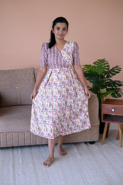 A comfortable ladies cotton midi nighty featuring a floral print skirt and geometric print yoke.