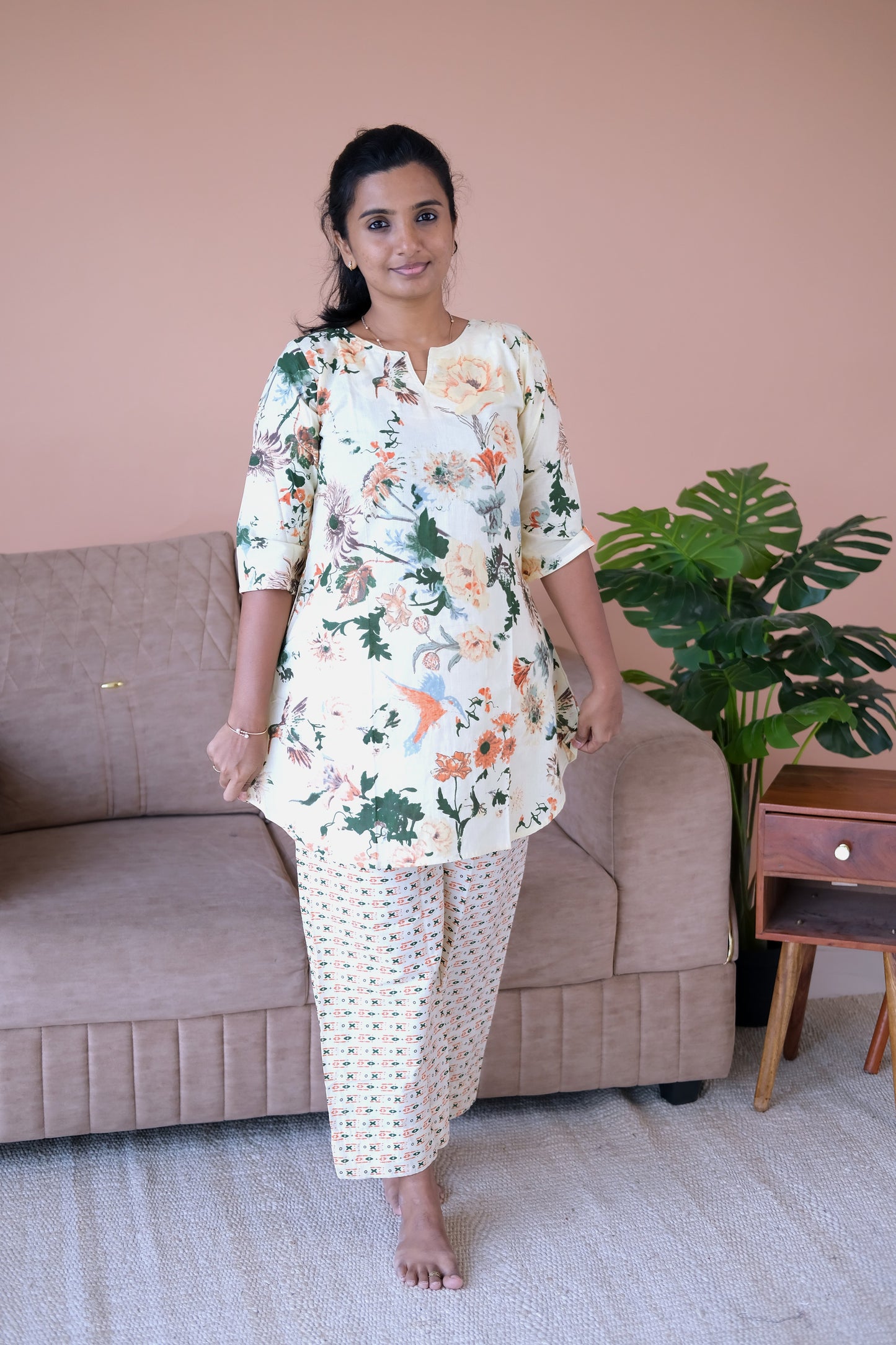A comfortable printed loungewear set in ivory cotton with elbow-length sleeves and a relaxed-fit straight pant.