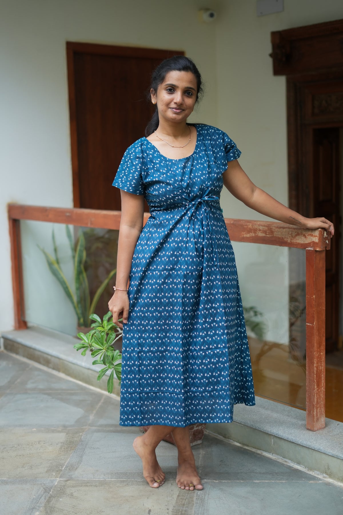 Mid-calf length adjustable tie nighty in teal blue cotton with white floral prints