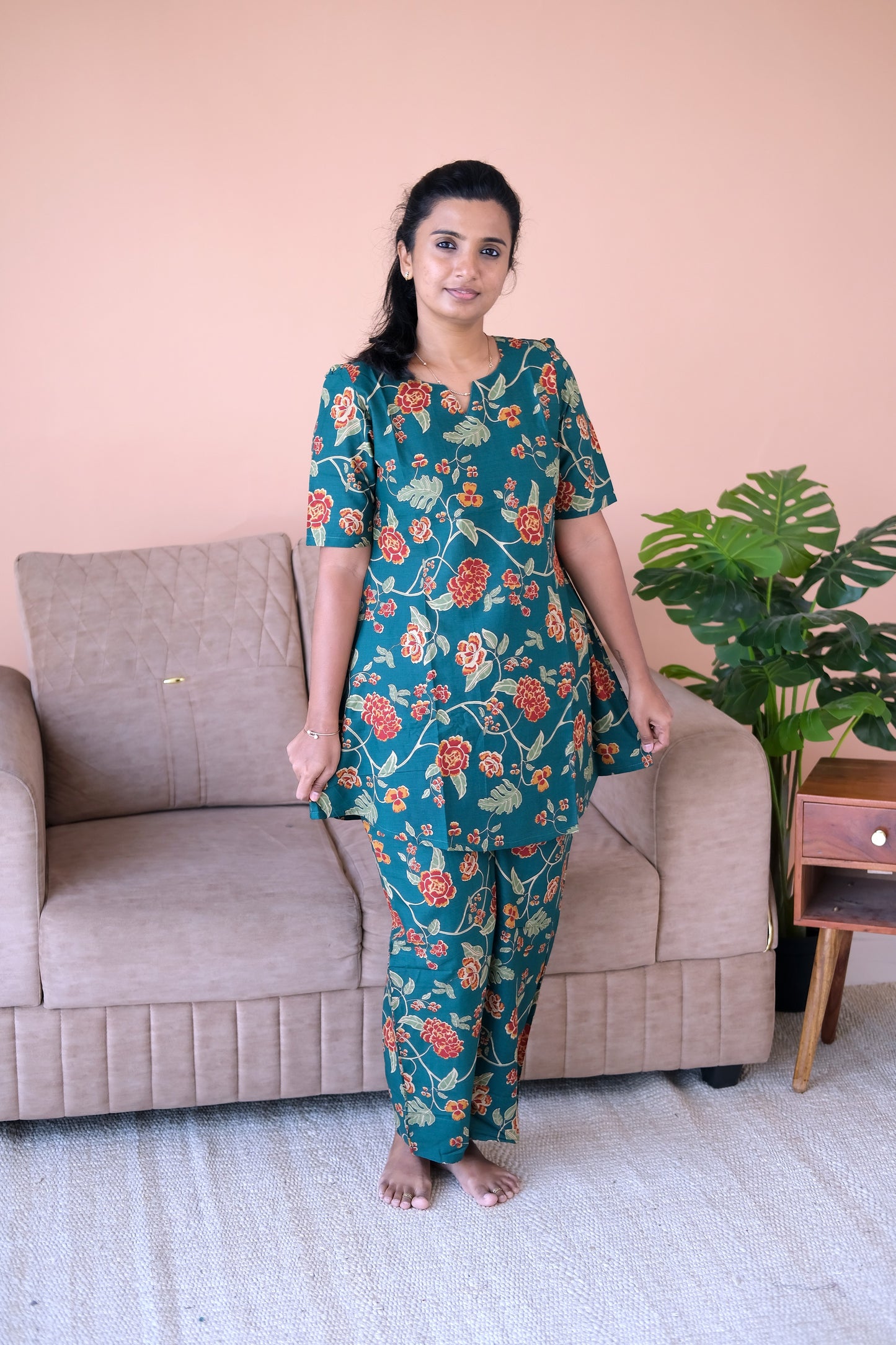 Relaxed-fit printed loungewear set in deep teal cotton with short sleeves and a notch neckline.