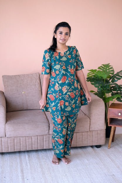 Relaxed-fit printed loungewear set in deep teal cotton with short sleeves and a notch neckline.