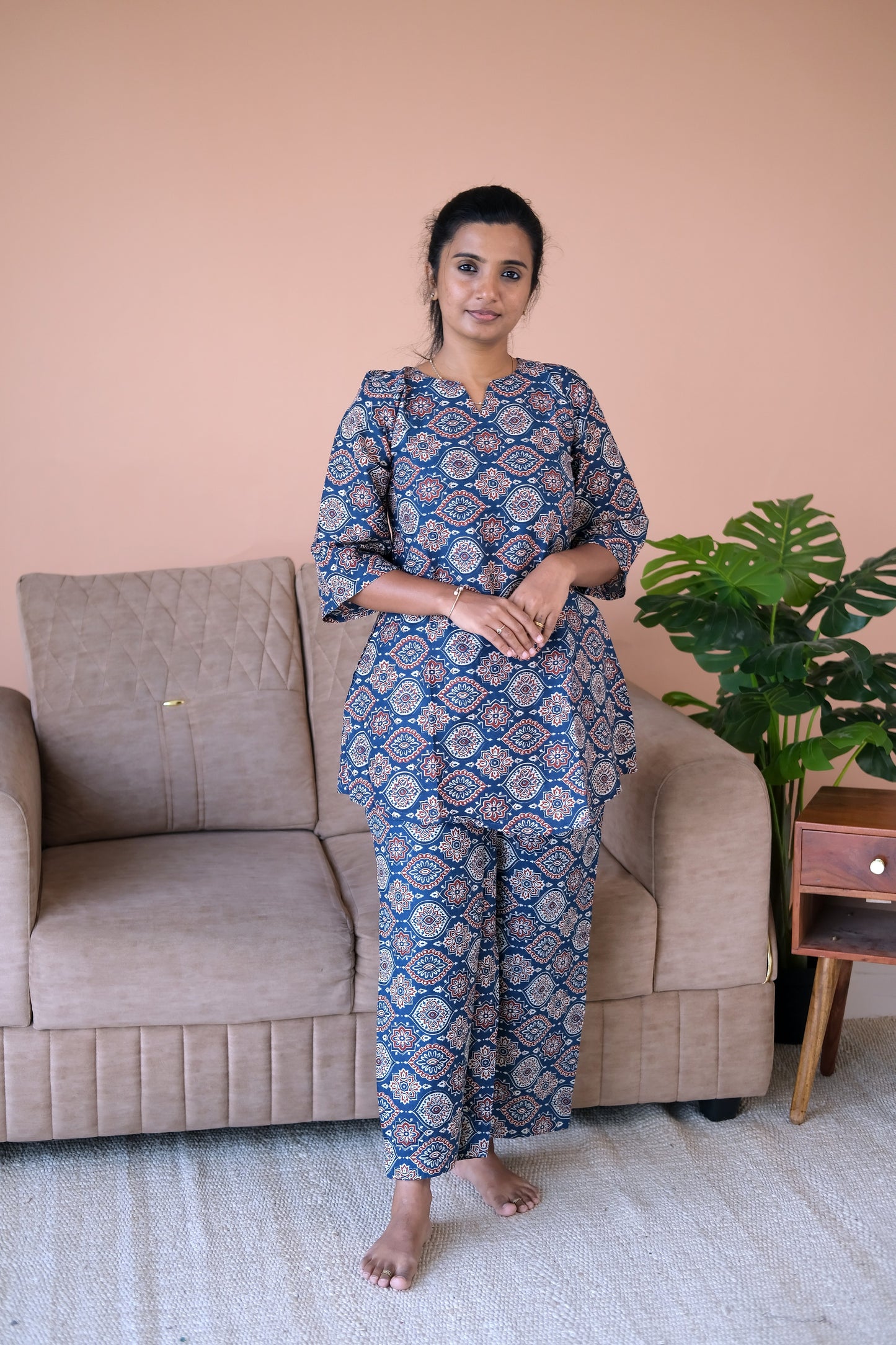 cotton night suit for women - Woman wearing a matching indigo night suit with traditional block prints and bell sleeves