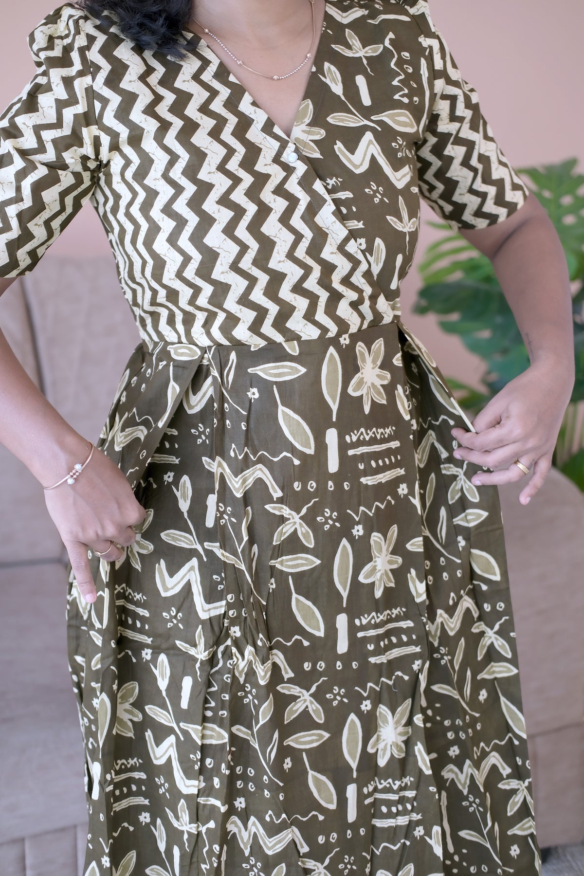 Close-up of the olive green ladies cotton nighty showing the side pocket detail and printed fabric.