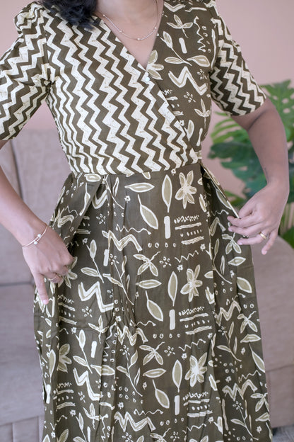 Close-up of the olive green ladies cotton nighty showing the side pocket detail and printed fabric.